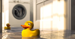 rubber duck floating in flooded laundry room